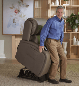 A man with his lift chair. He has a blue shirt. He is living on his own.